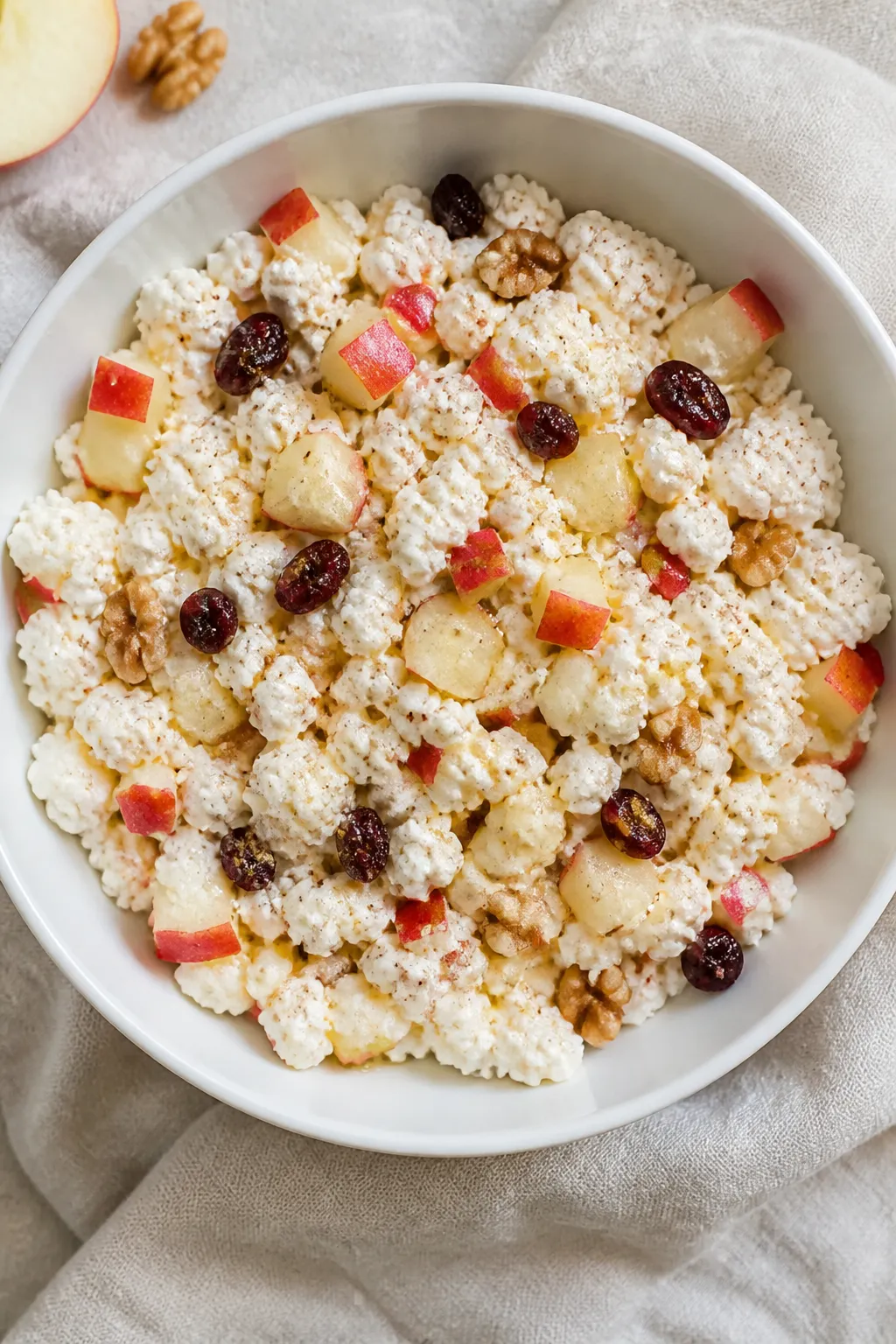 Overhead shot of the prepared cottage cheese and apple salad just after mixing, showing intact small